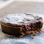 Gluten-free chocolate & Morello Cherry Tart on slate from Riverside Bakery 