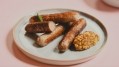 Guests at the session were invited to taste the firm's cultivated pork sausages. Credit: Meatable