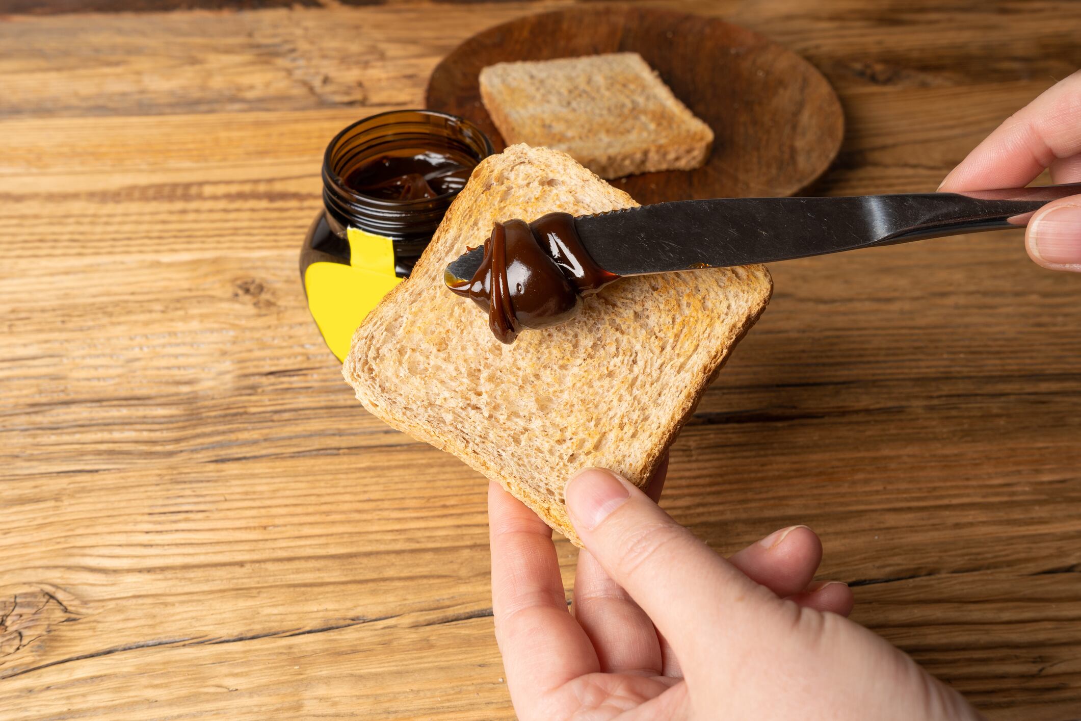 Warsaw, Poland, October 30, 2023: Marmite Yeast Spread, Vegemite Spread, Australian Healthy Breakfast, Traditional English Black Beer Yeast Extract, Toast Food Paste, Marmite Spread, Editorial Image