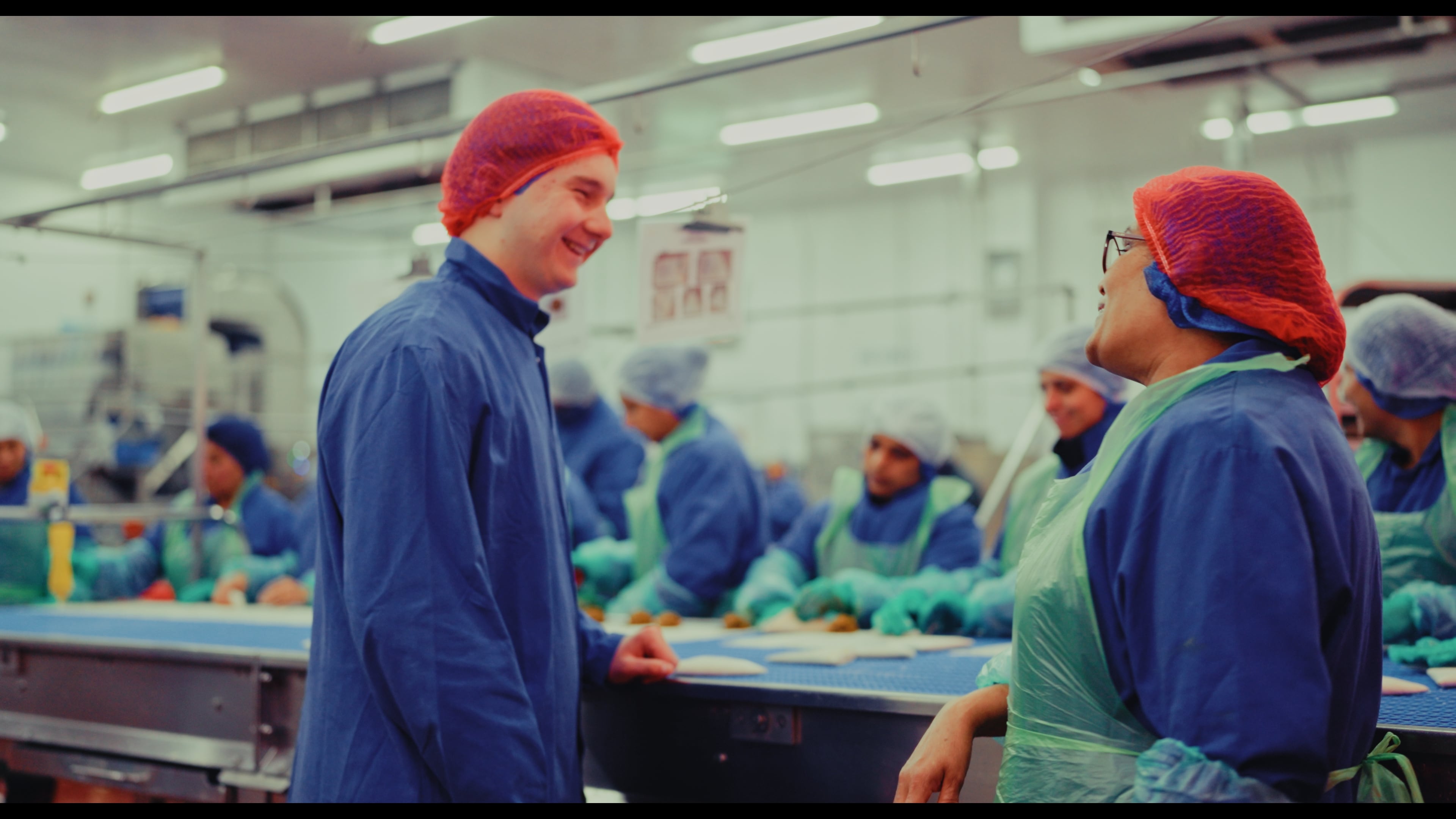 An apprentice working at a food manufacturing site
