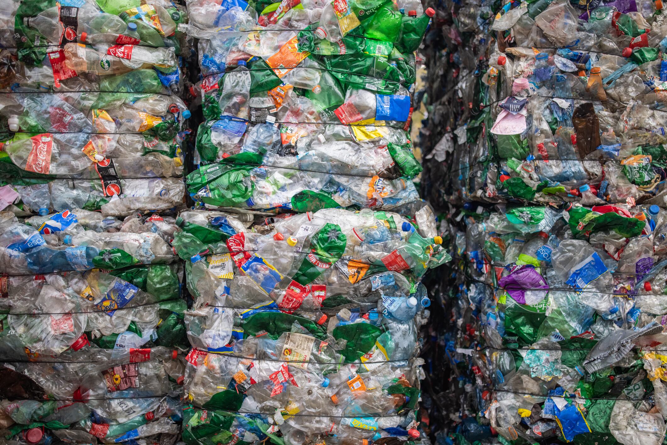At the recycling centre, plastic bottles are collected and packed for recycling.