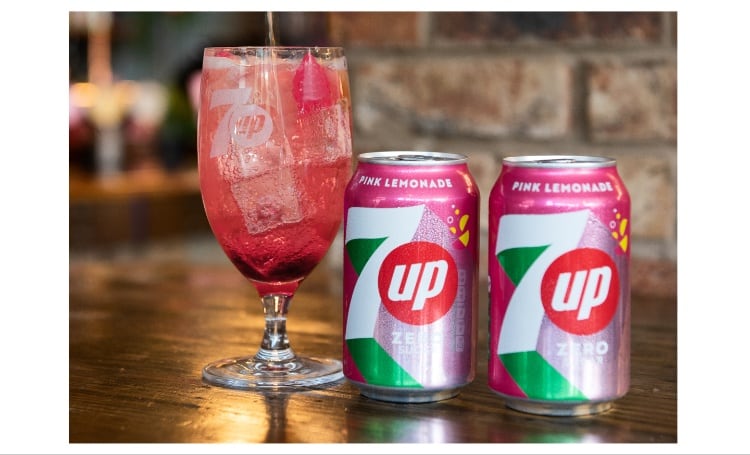 A glass of shandy and 7up can