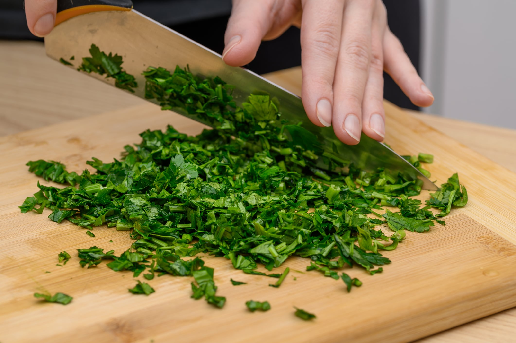 Parsley green bunch chopped with a knife close-up