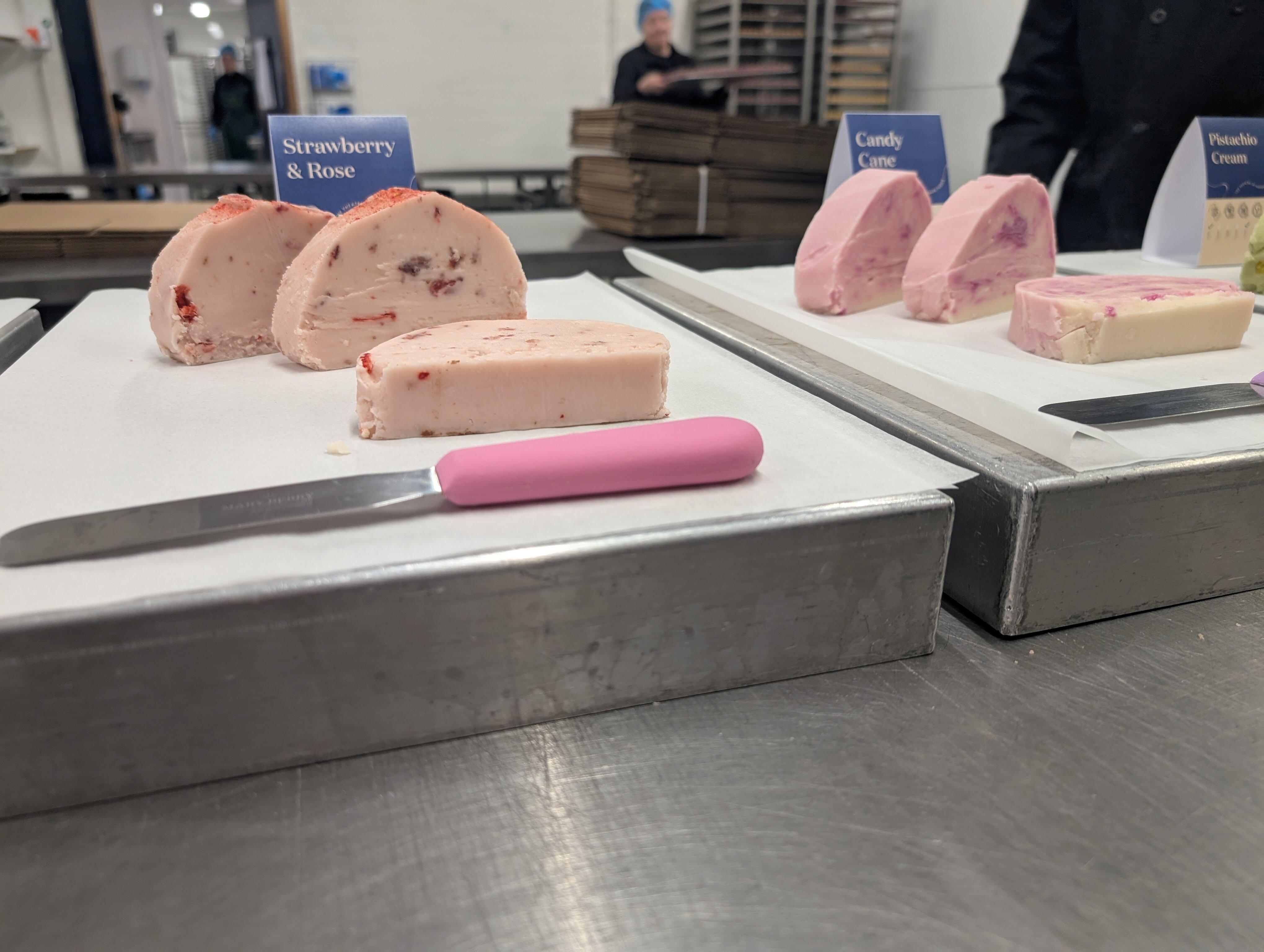 Fudges on slabs with knives.