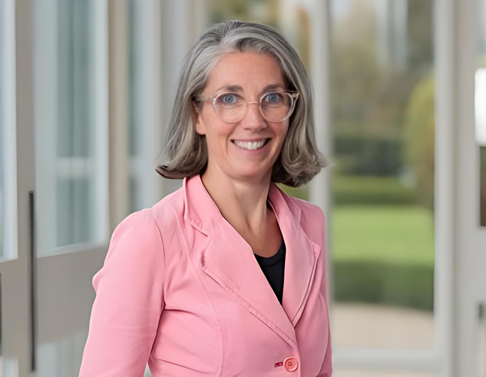 A corp headshot of a woman.