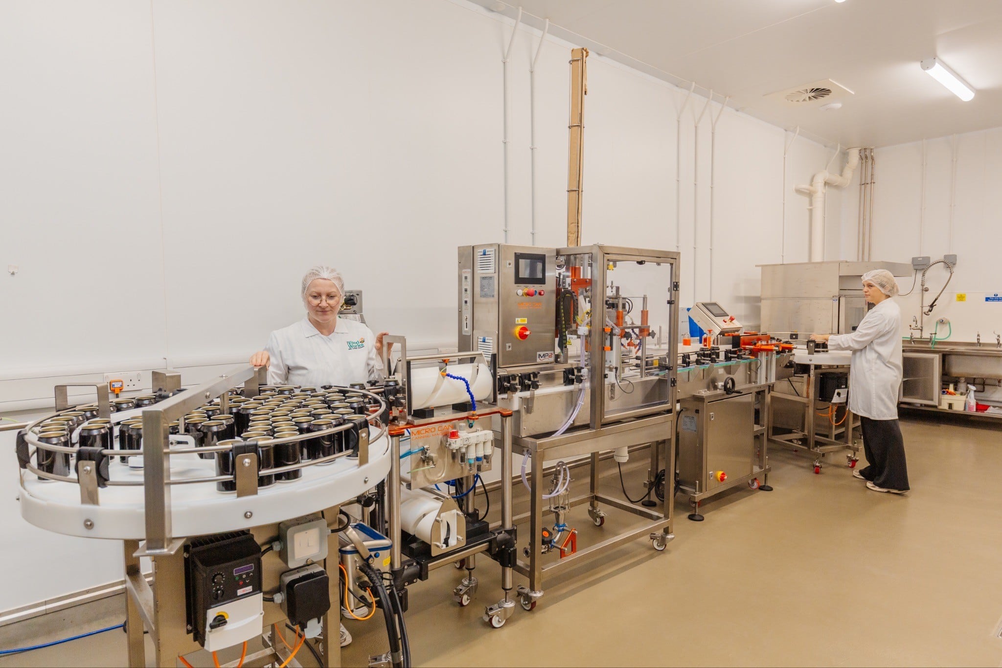 Canning line with staff