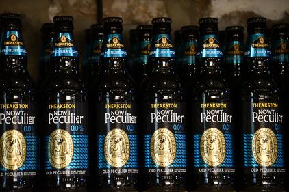 Several bottles of Theakston's Nowt Peculier ale