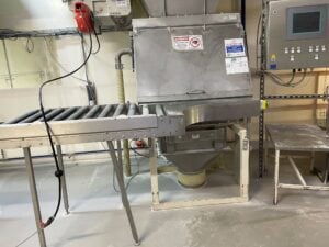 Photo showing white dust on the floor around equipment