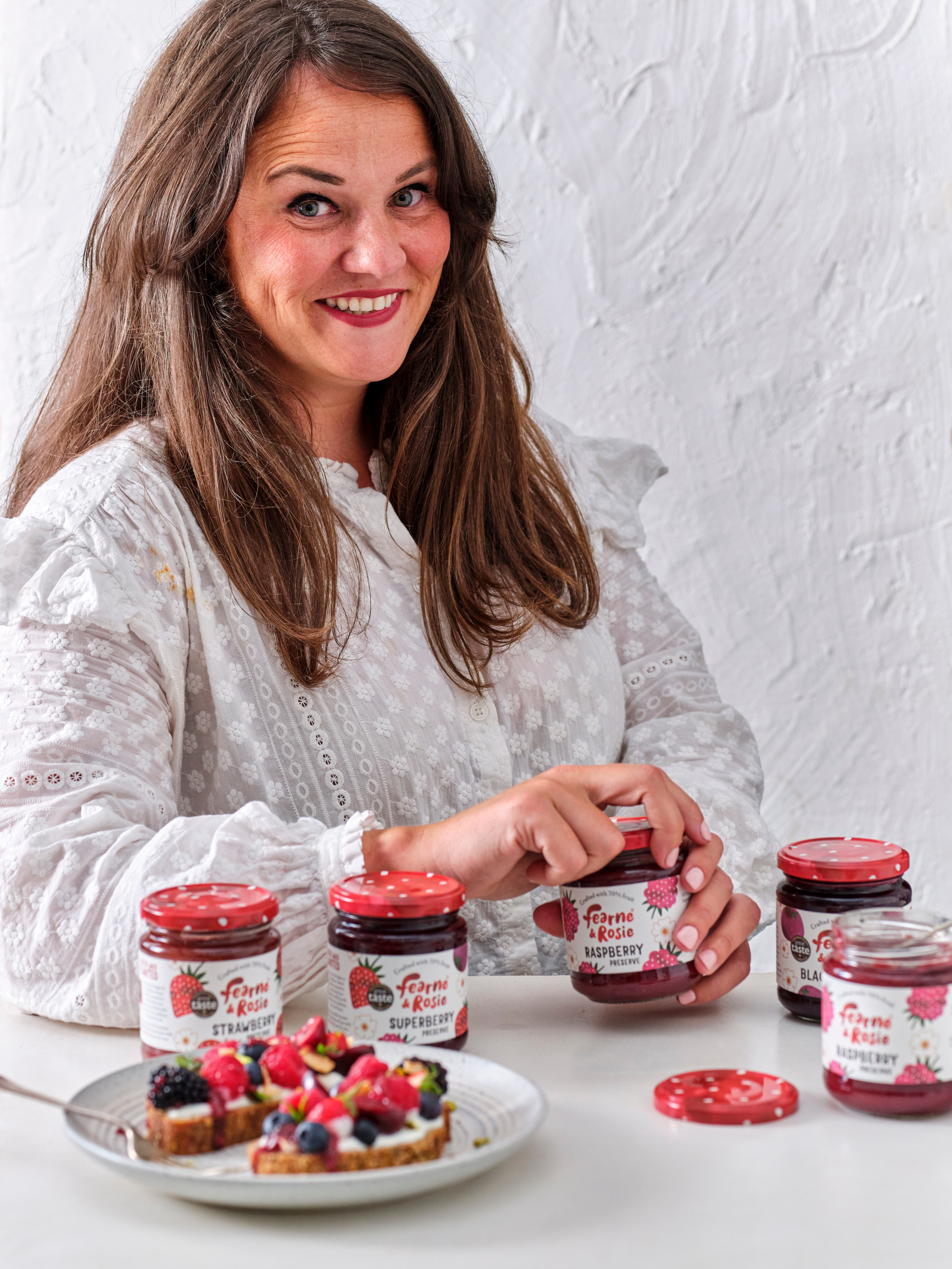 A woman with jam jars