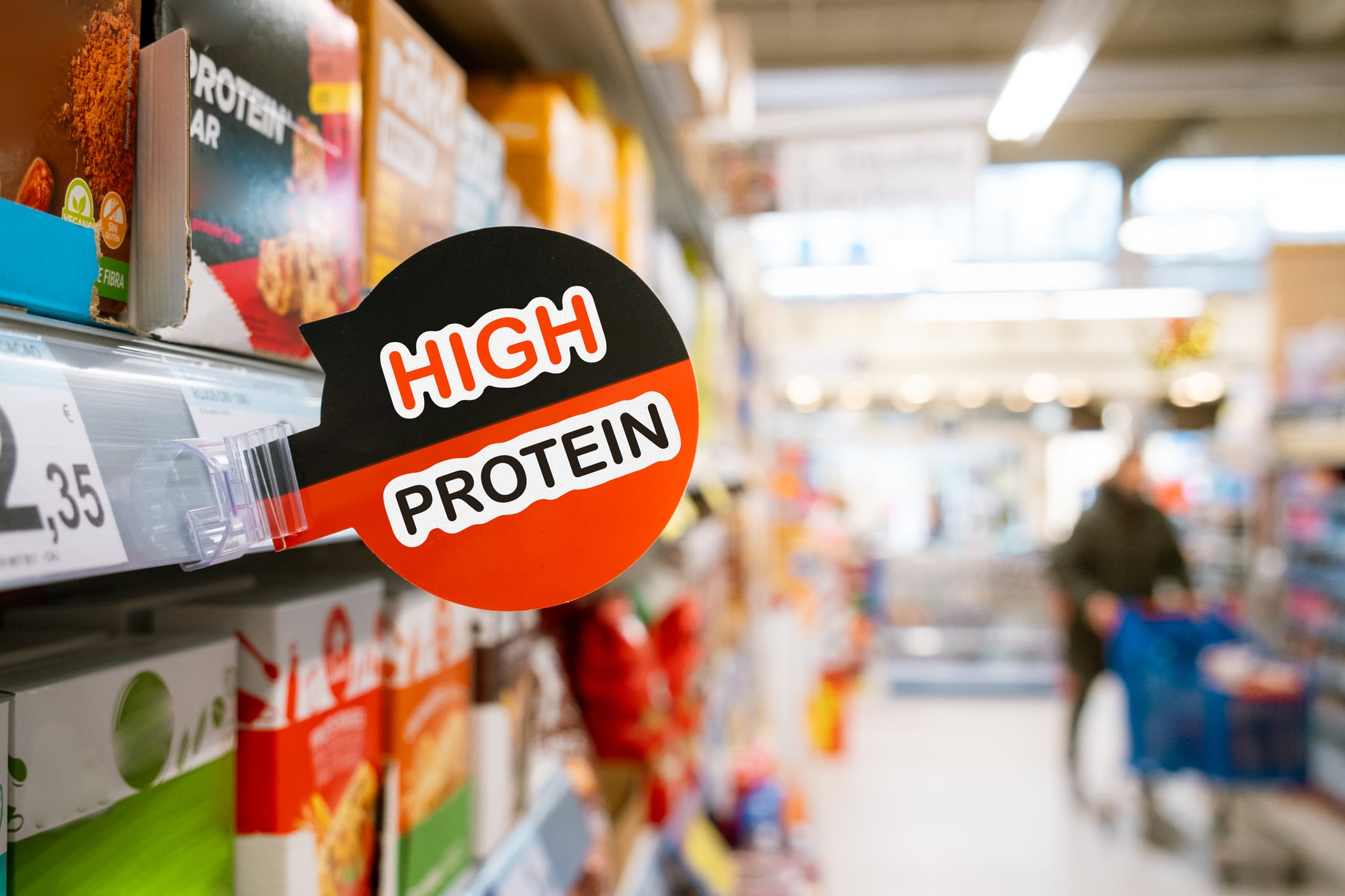 A high protein sign in a supermarket aisle