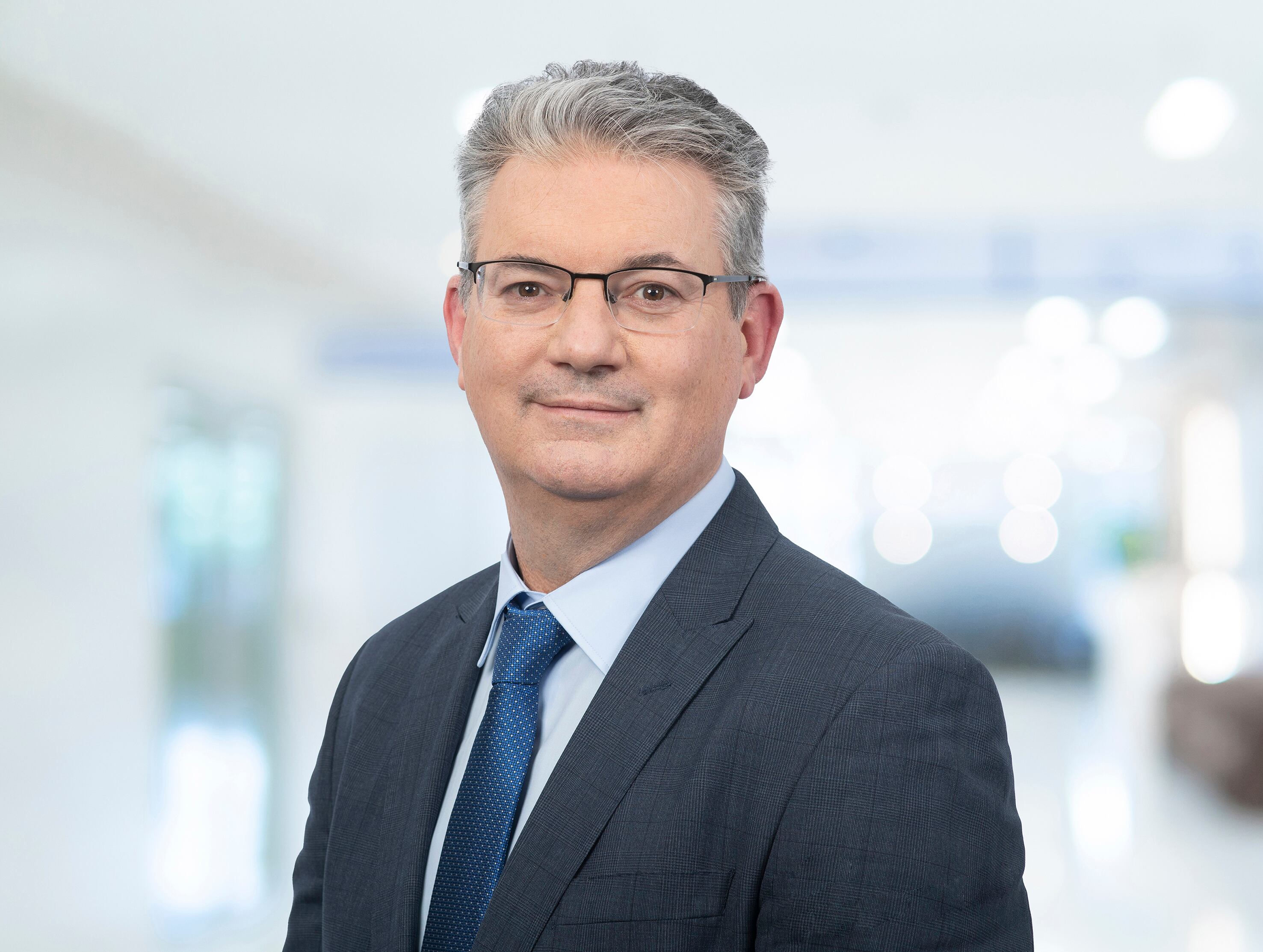 A corporate head shot of a man