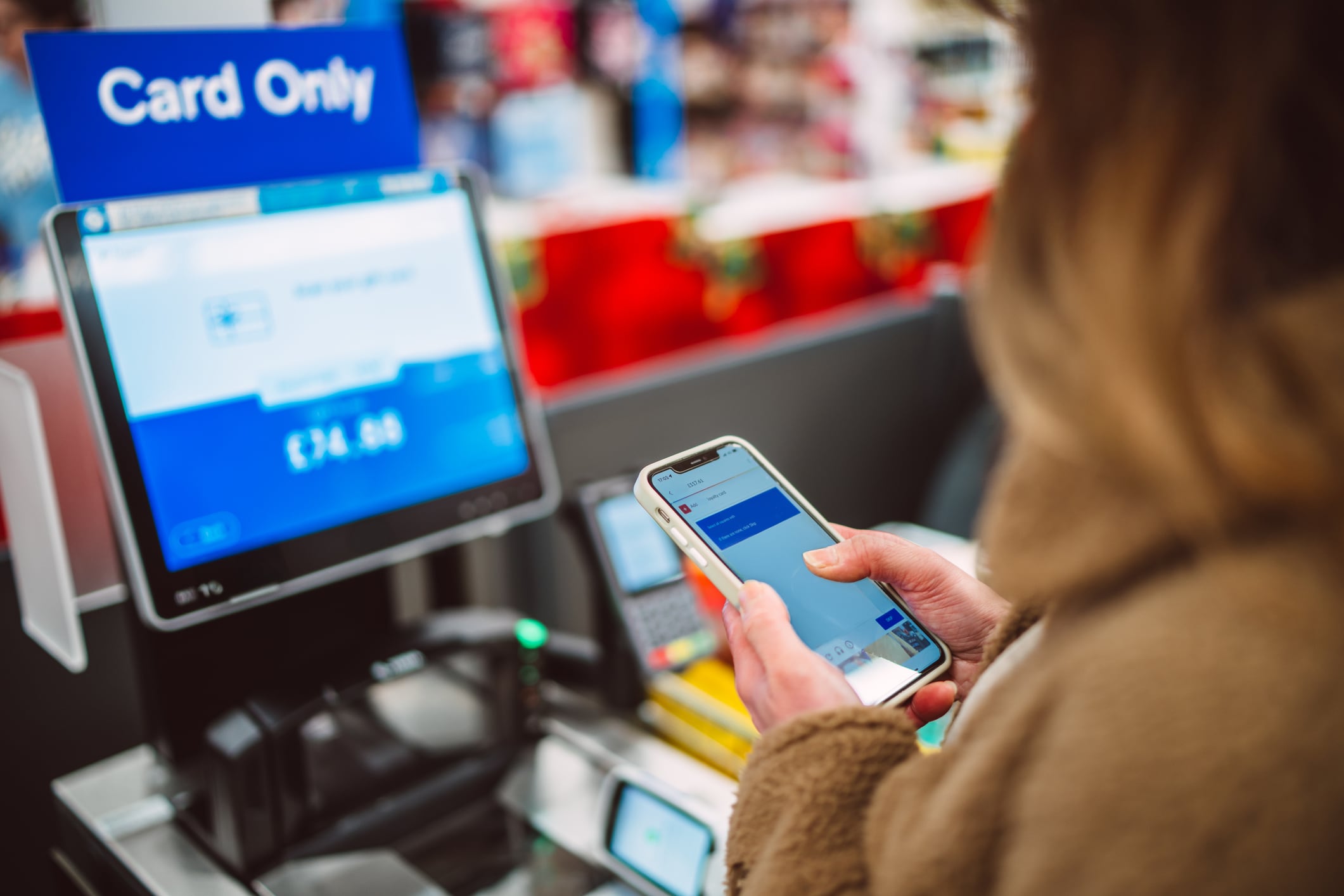A woman at a self checkout