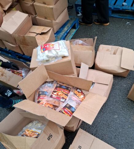 Suspected illegal food products being made ready for disposal by National Food Crime Unit.