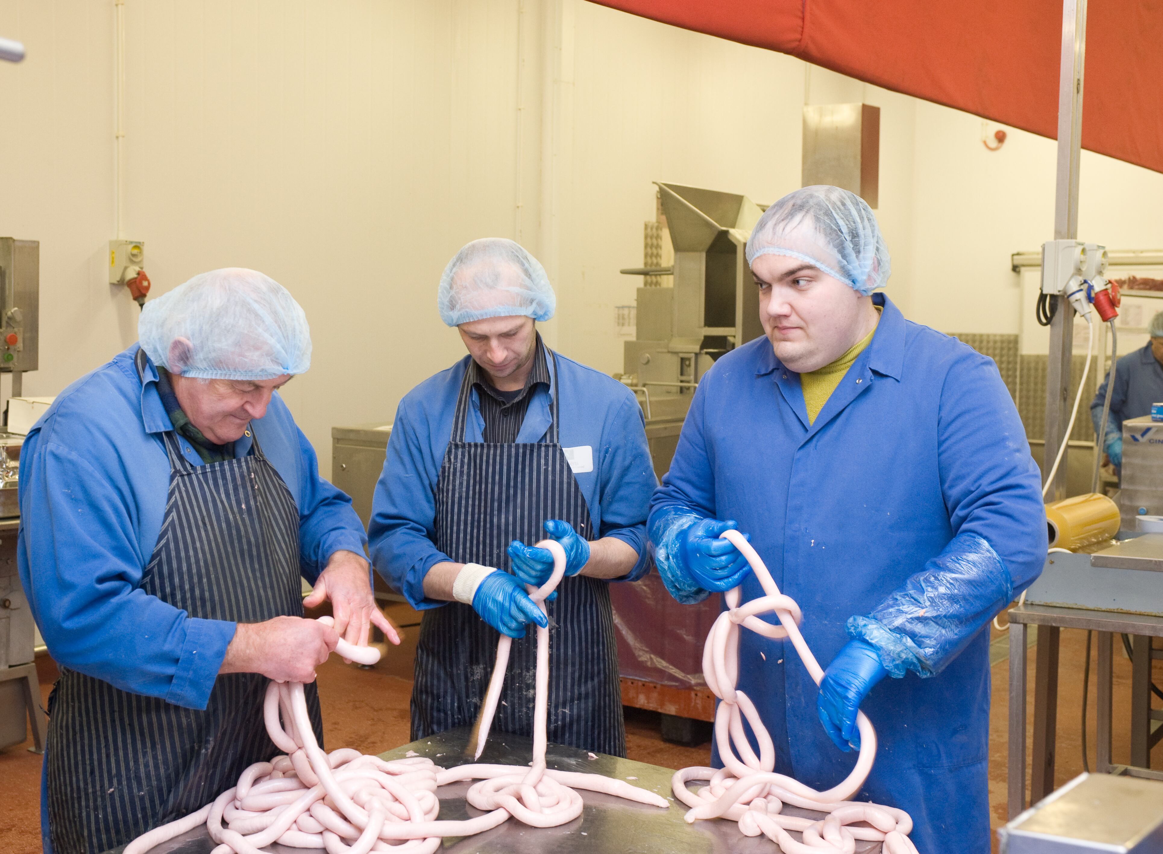 Workers at a meat factory/