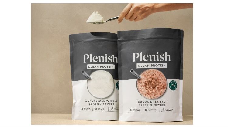 Plenish protein powders and a hand holding scoop