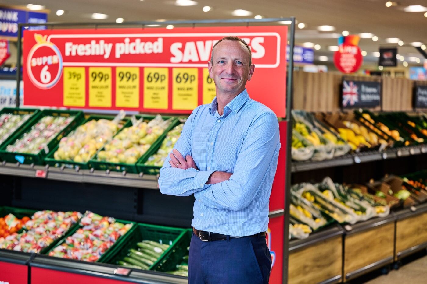 Giles Hurley standing in Aldi supermarket.
