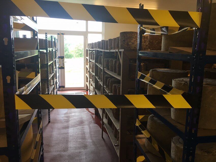 E.coli death linked cheesemaker lays off staff