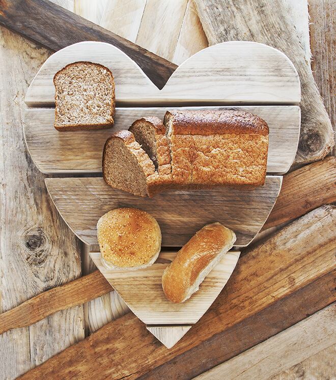 Breads-on-rustic-vintage-heart-background-loving-healthy-food-AdobeStock_259803965.jpg