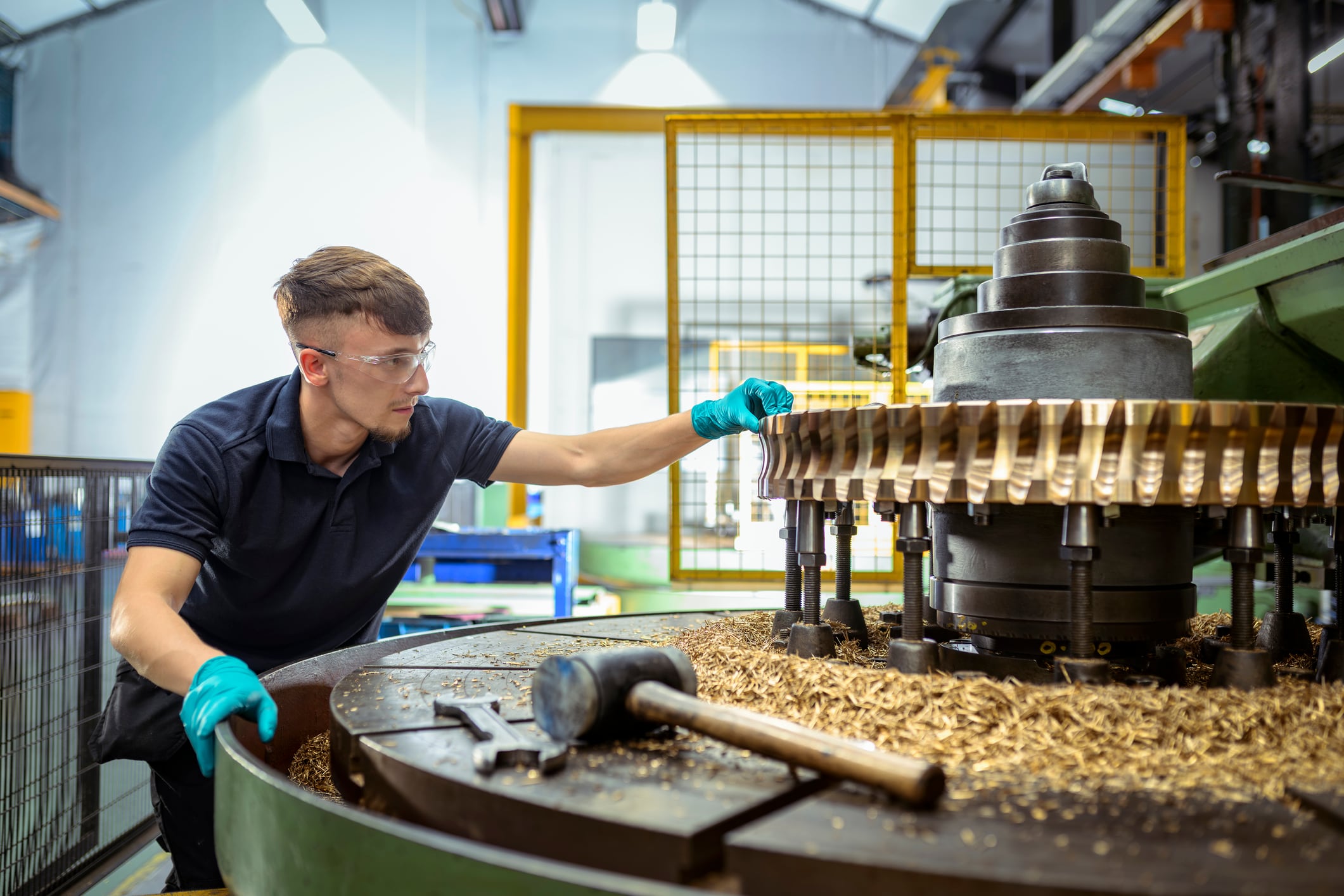 An engineer inspecting production equipment