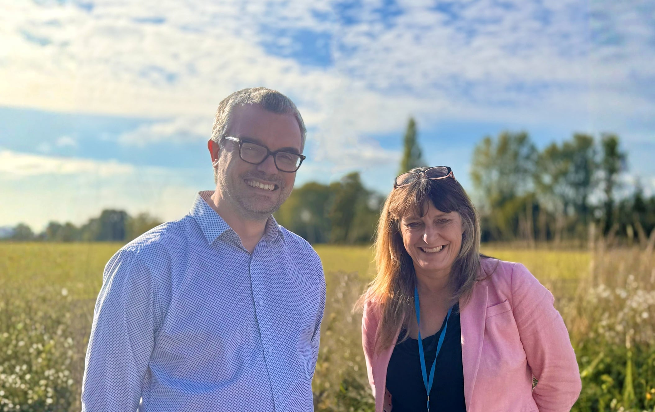 Matt Smith and Linda Evans in a field.