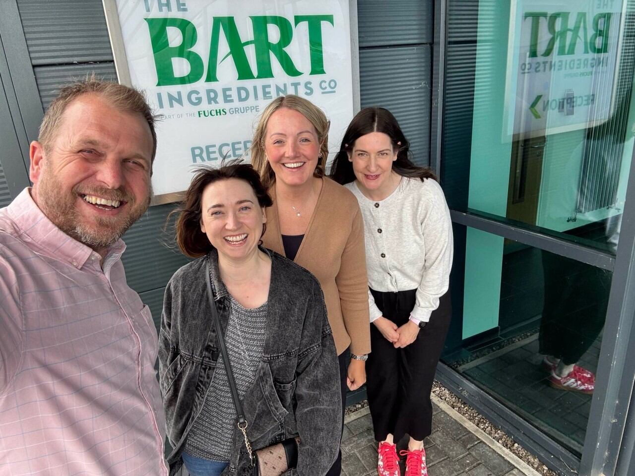 A group of people outside Bart Ingredients factory.