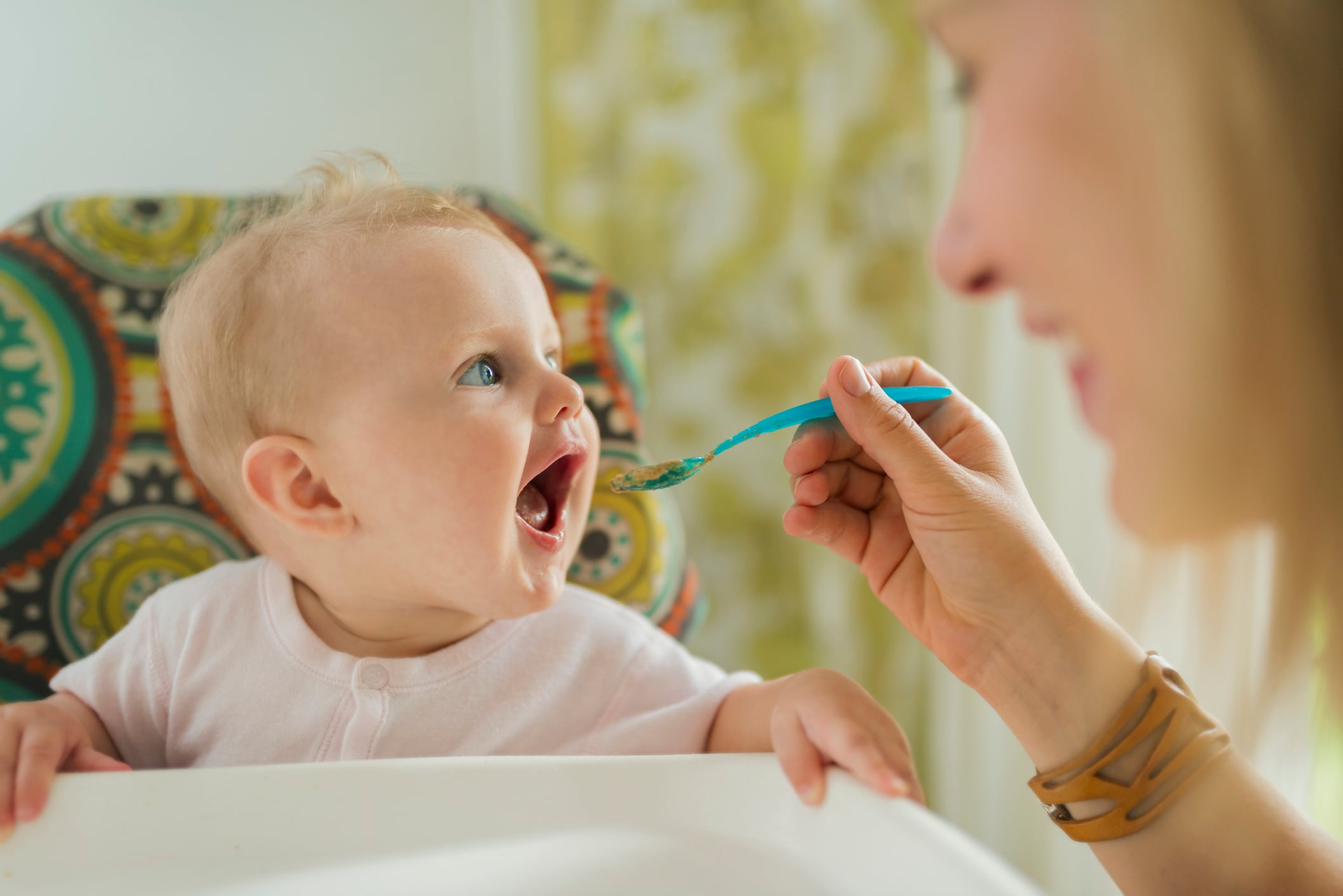 A mother feeding baby.