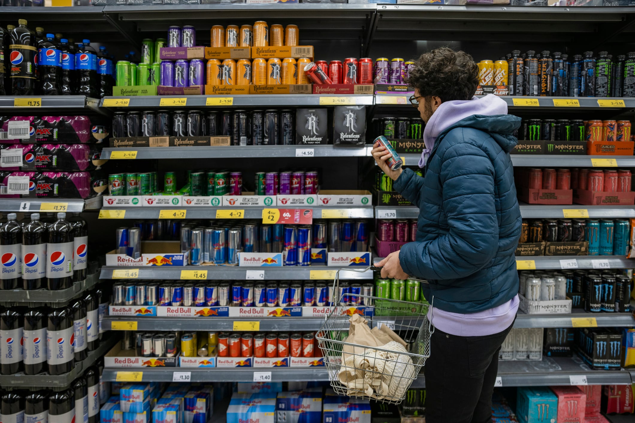 A man shopping for energy drinks.
