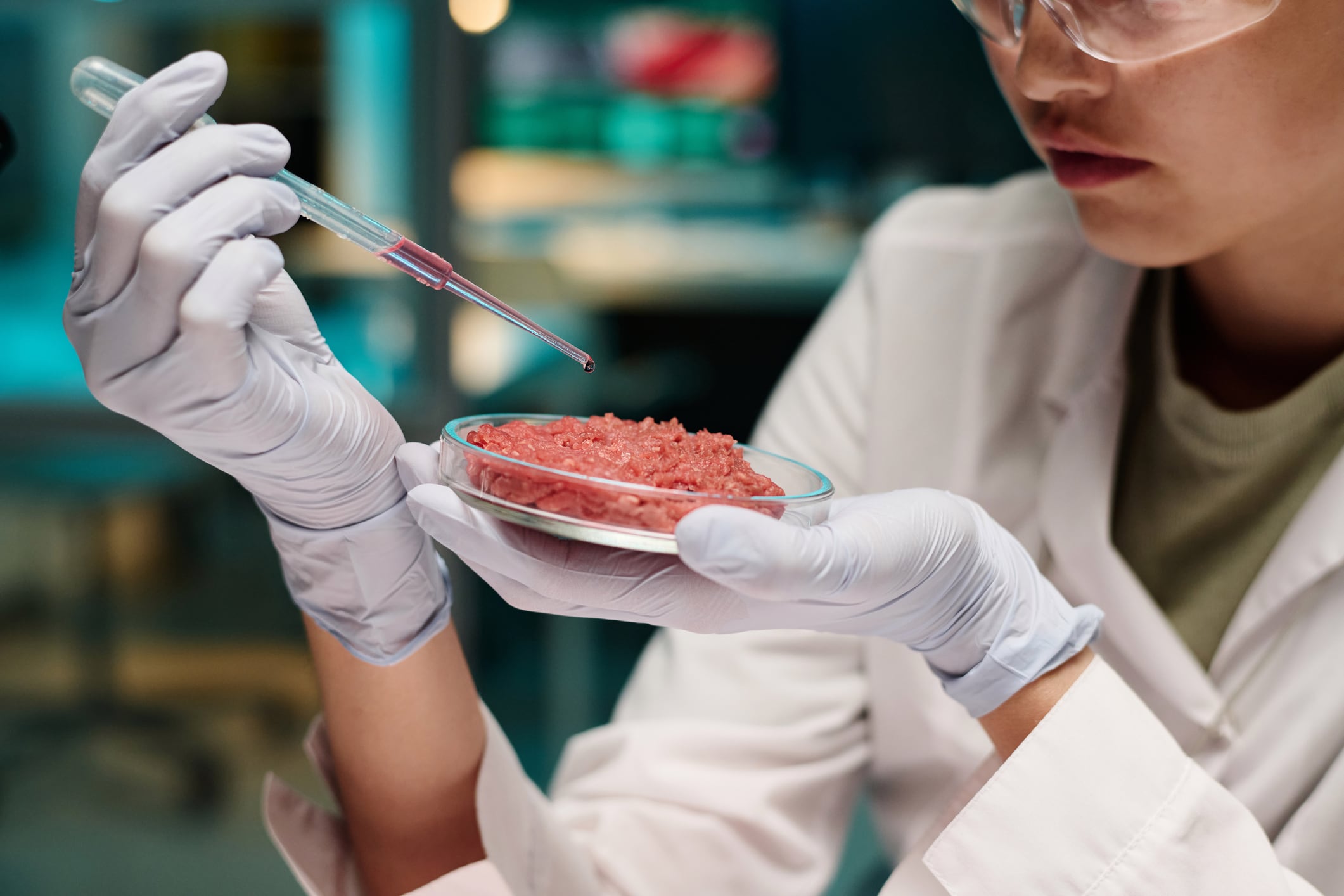 Woman making lab-grown meat.