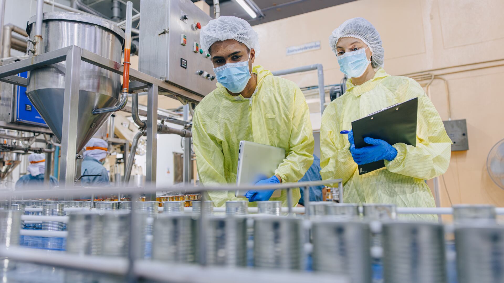 Factory workers checking the production line