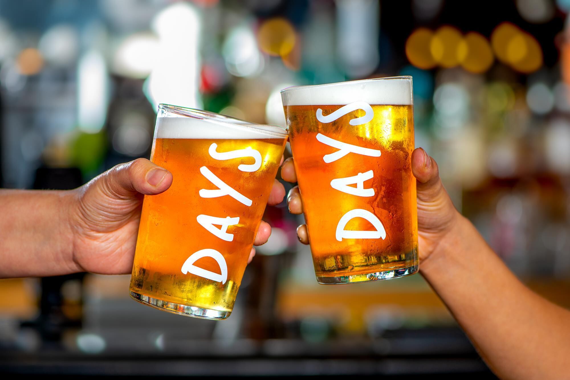 Two beers being held up