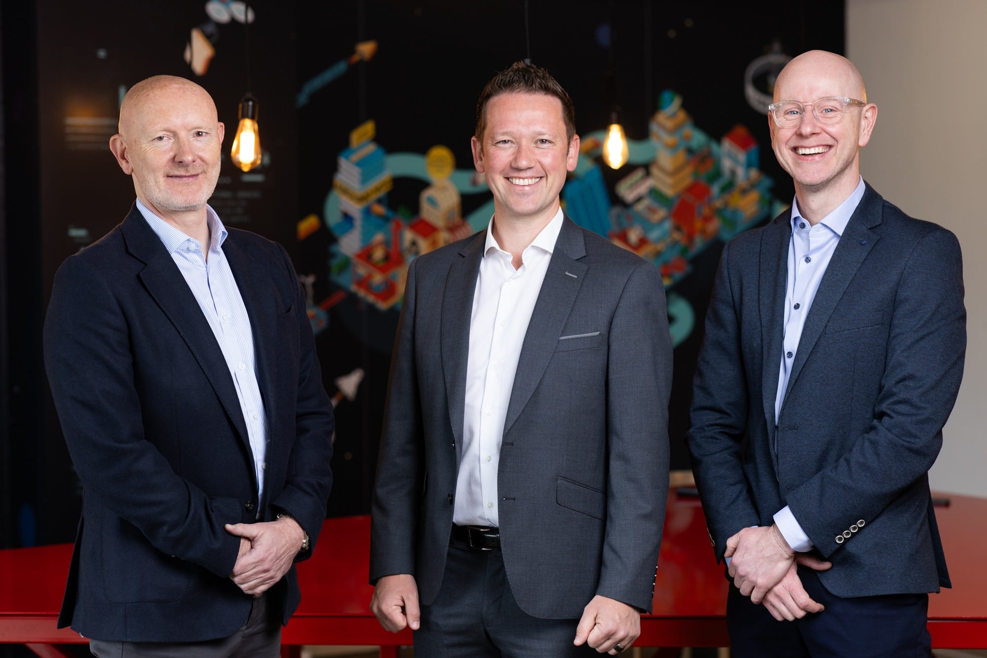 A corporate shot of three men.