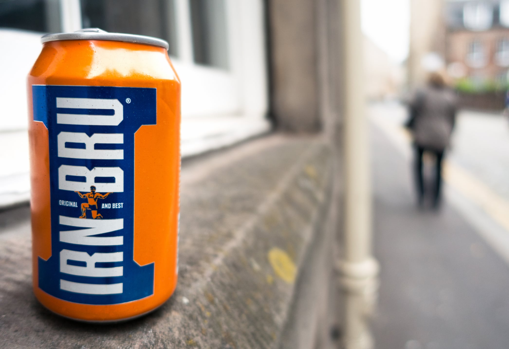 A can of Irn-bru on a street