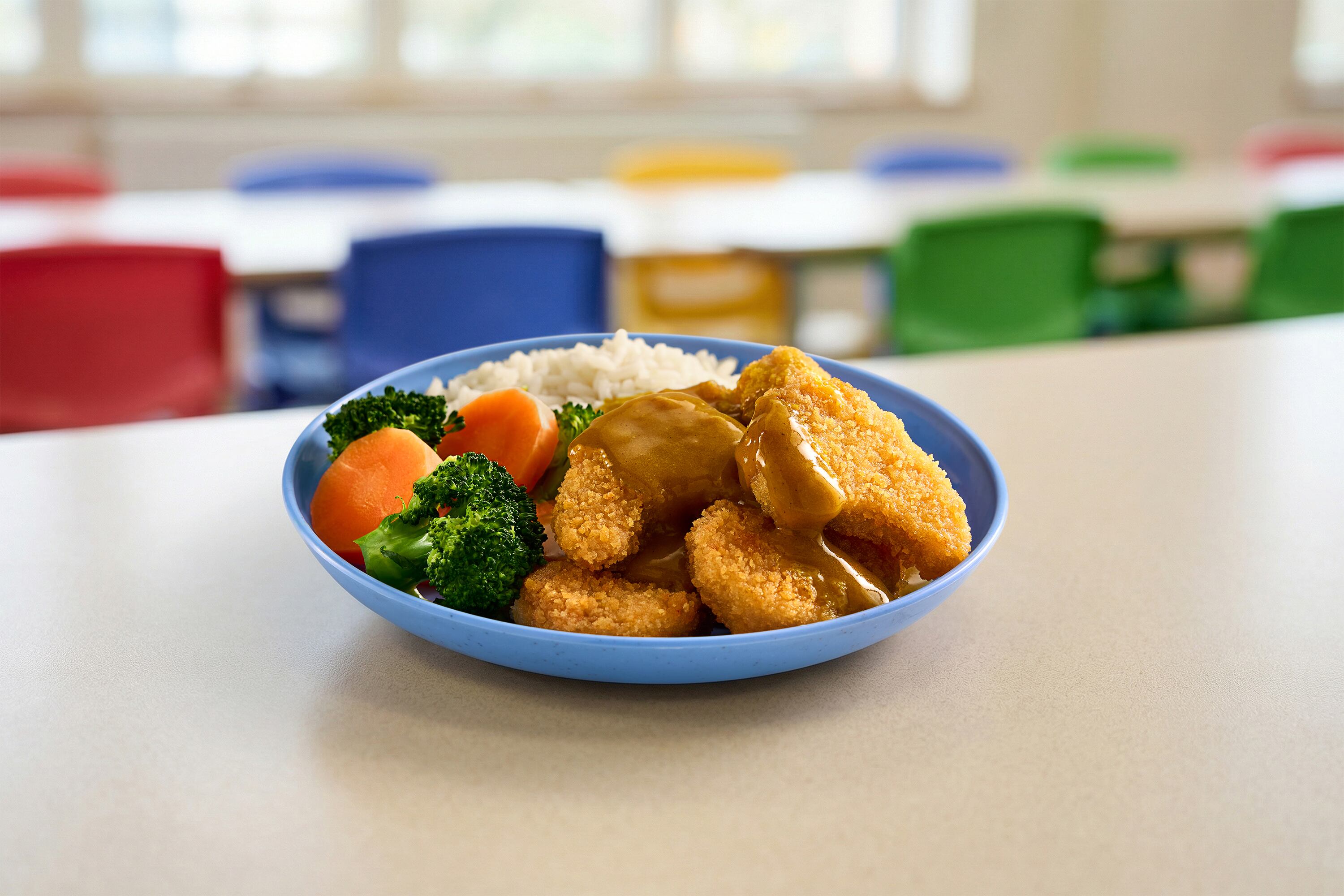 A plate of vegan dippers with rice and veg