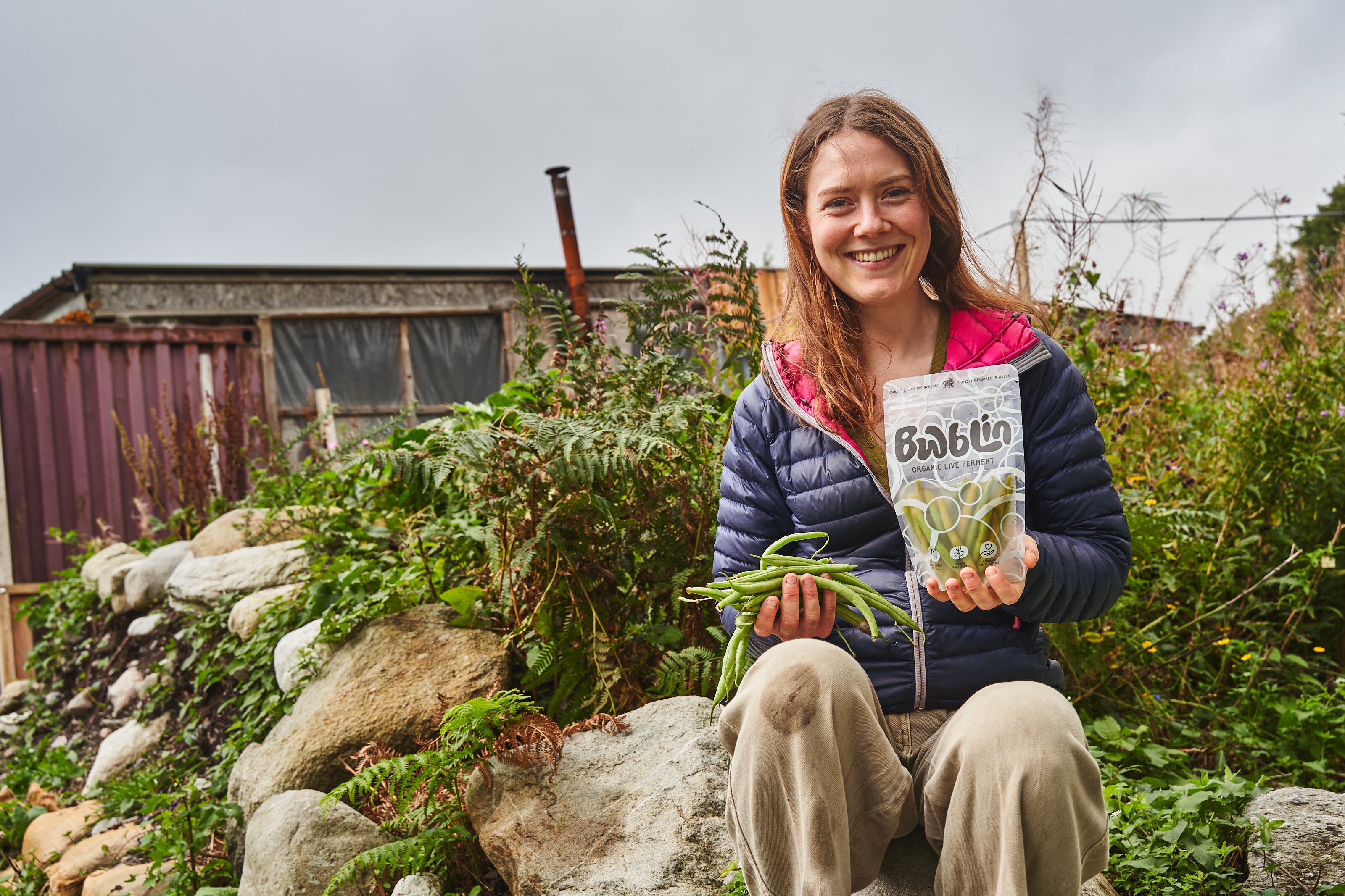 Woman holding pack of fermented food