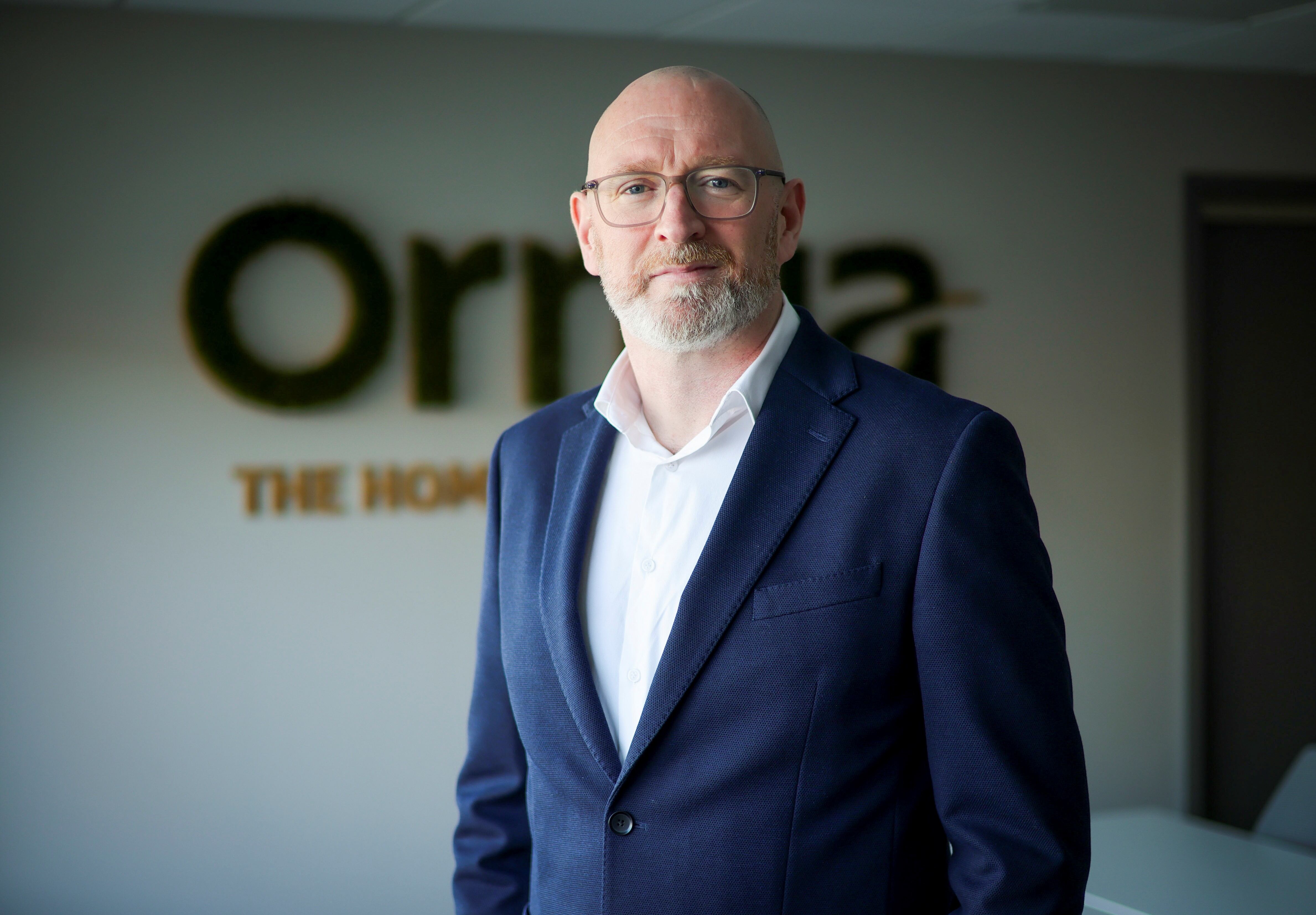 The corporate headshot of a man.