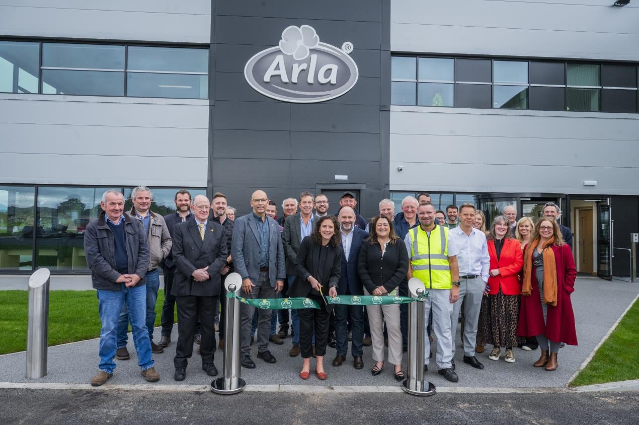 Outside Arla Lockbie site with crowd and ribbon cutting.