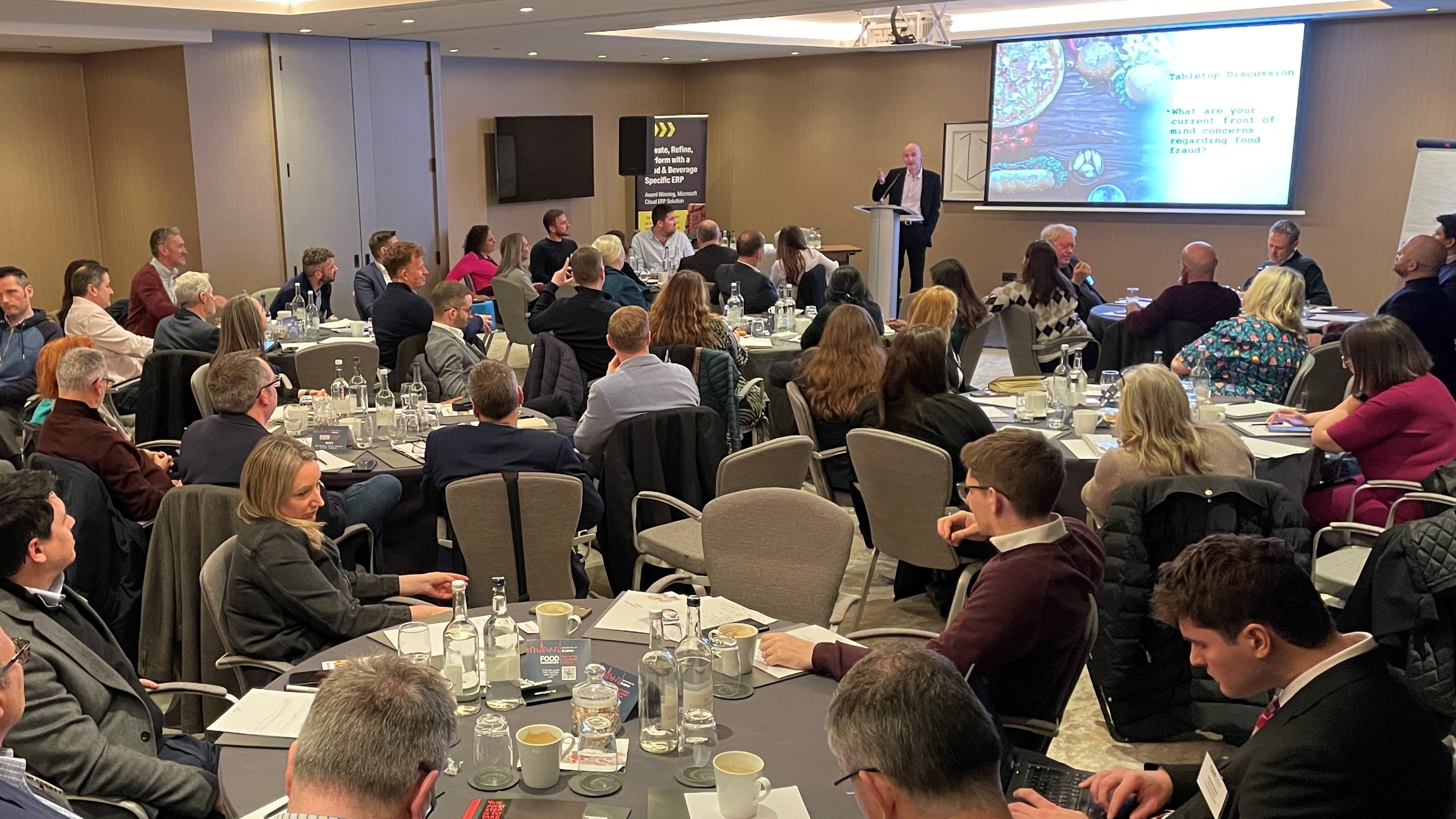 Business Leaders' Forum 2025, conference, people listening to presenter.