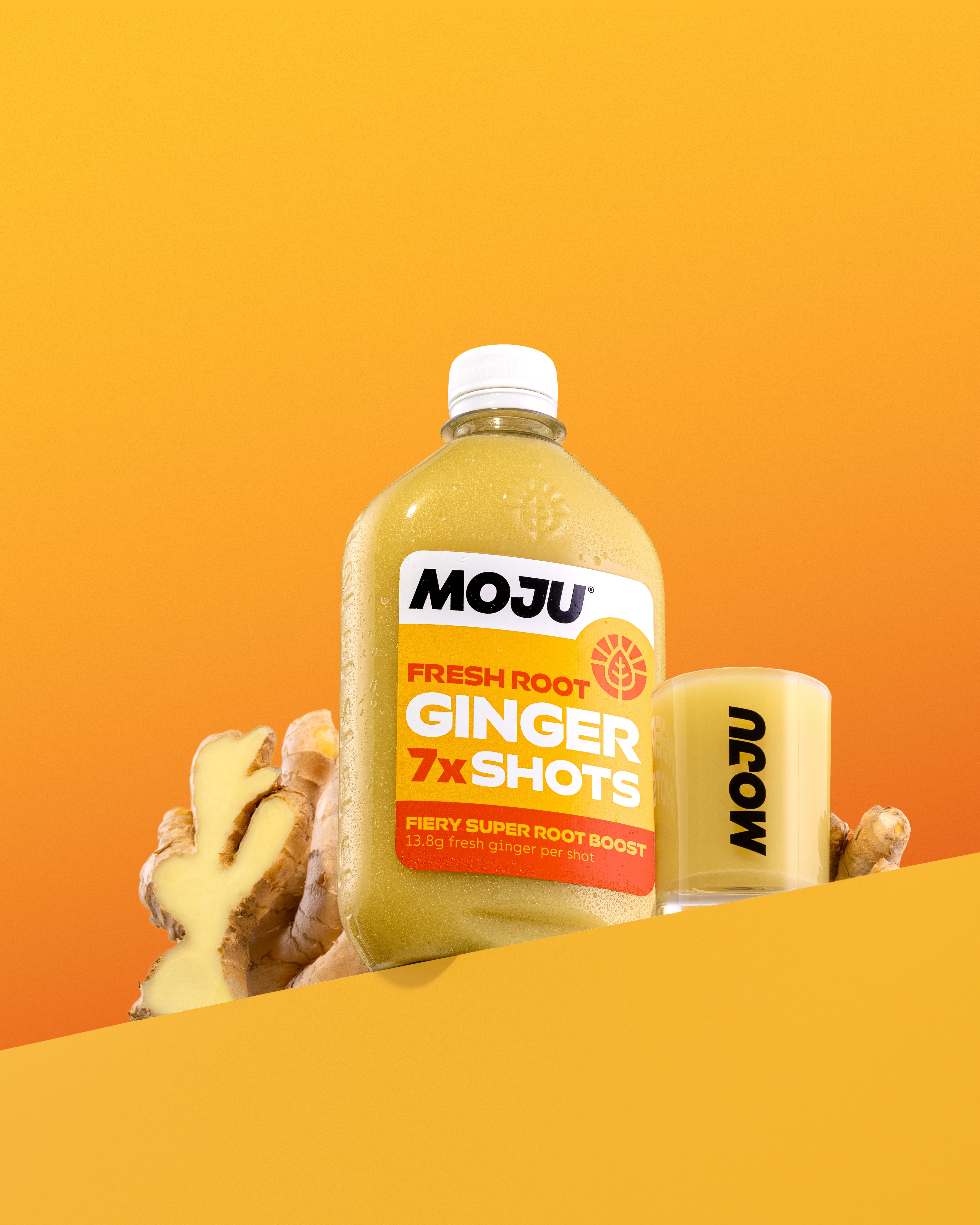 MOJU bottle - ginger, with a shot glass.