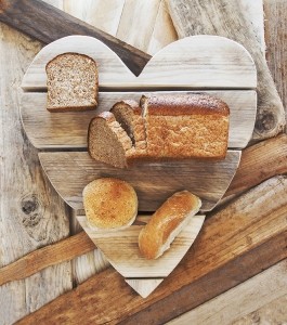Breads on rustic vintage heart background loving healthy food-AdobeStock_259803965