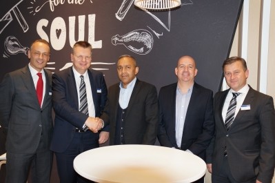 Jeff Donald, Marel Poultry UK area sales manager (2nd left) seals the deal for the broiler processing kit with Maelor Foods's owner Raj Mehta (centre) 