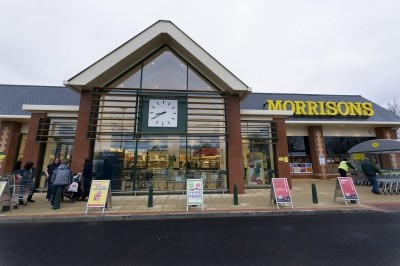 Morrisons has reported half-year profits down by more than 30%