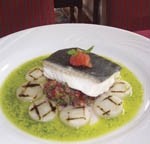 Steamed halibut with artichokes, tomato salsa and pesto dressing