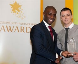 BBC TV's The Apprentice winner, Tim Campbell (left) presents Calum Marnock, from Kraft Foods, with a trophy at the FDF Community Partnership Awards ceremony