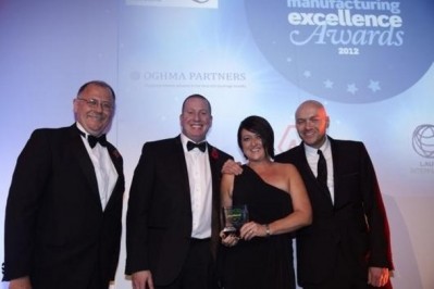 Britvic's Fran Ball and Ian Forrester receive the award from Food Manufacture editor, Rick Pendrous and TV chef Simon Rimmer 