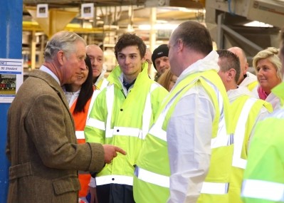 Prince Charles discusses clean-up efforts with factory workers in Carlisle 
