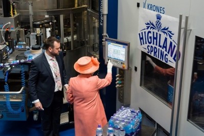 The Queen pressing the button on the new PET bottling line