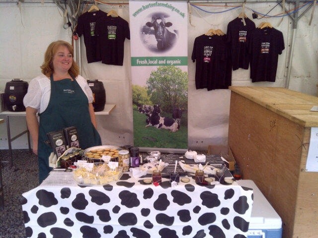 Barton Farm Dairy owner Linda Wright on stall selling products 