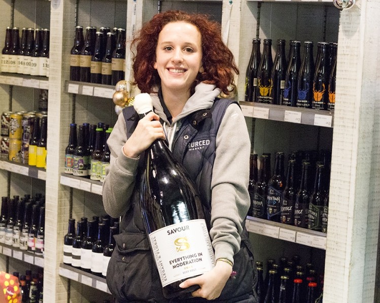 Sourced Market employee Tirza Woolfson-West struggles to hold all six litres of the rare beer