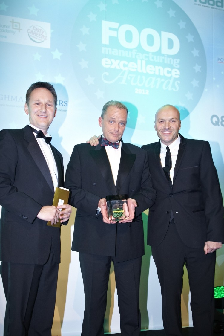 Grencore's operations director Philip Wild-Smith receives the award from NFT Distribution ceo David Frankish and TV chef Simon Rimmer