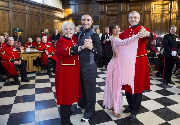 Simone and Cacace entertain Chelsea Pensioners at the cheese ceremony